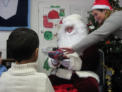 Santa gives gifts and listens to the children’s wishes
